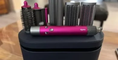 a group of hair dryers and hair rollers on a black box